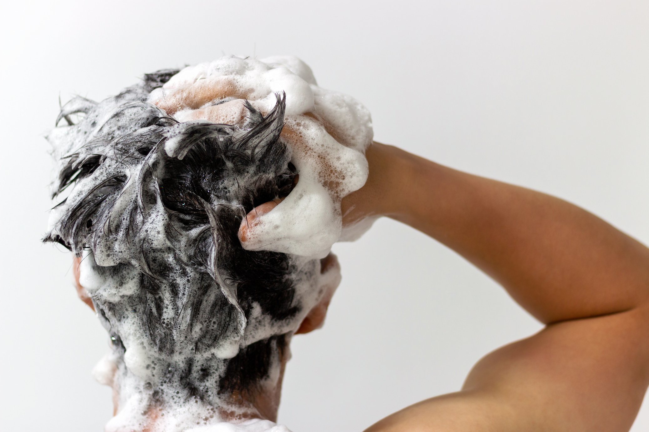 Man Washing His Hair with Shampoo 