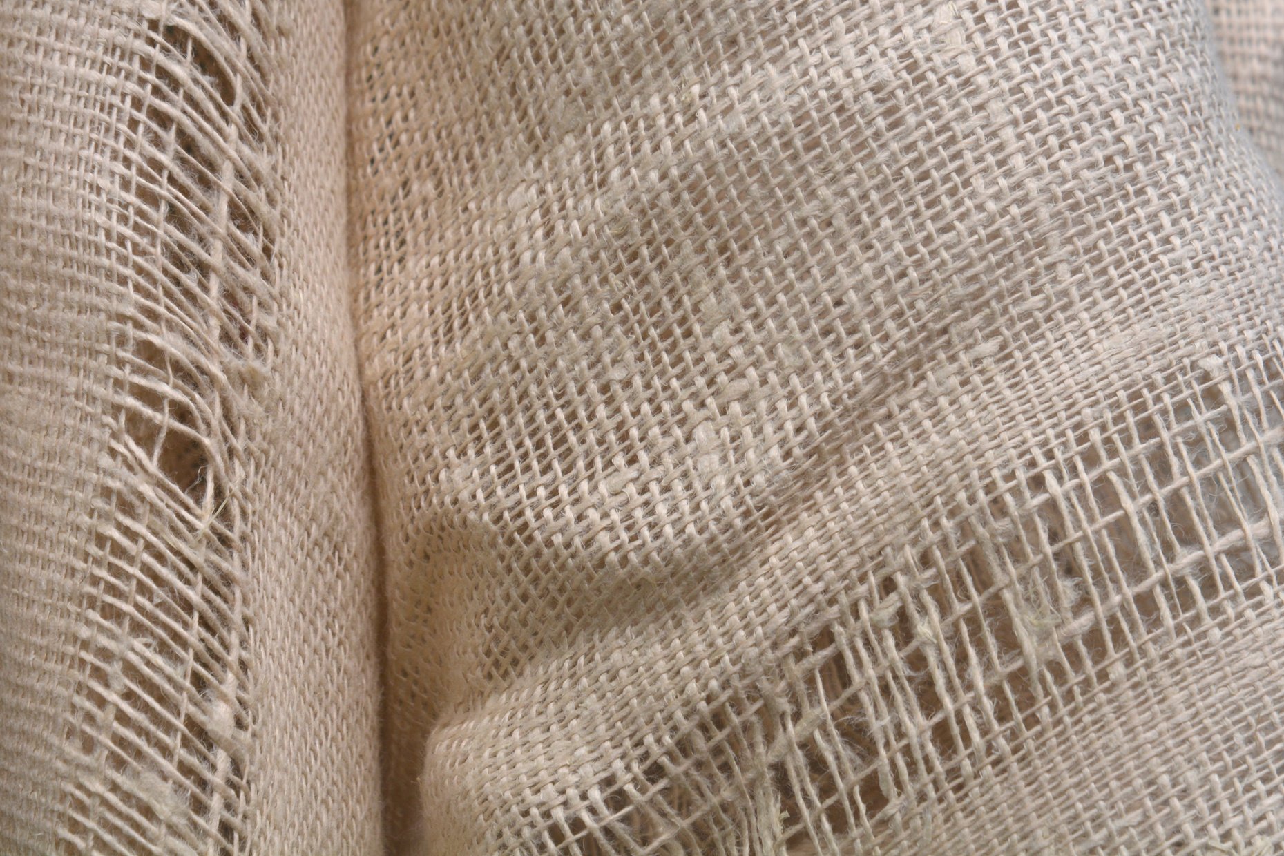 light linen fabric . natural linen fabric texture . crumpled beige linen fabric